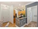 Modern kitchen featuring wooden cabinets and stylish backsplash at 2934 Selwyn Ave, Charlotte, NC 28209