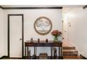 Inviting foyer with decorative wall art, elegant console table, and warm lighting at 3000 Imperial Dr, Gastonia, NC 28054
