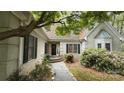 Inviting front entrance with stone walkway and meticulously maintained landscaping at 3011 Lakewood Edge Dr, Charlotte, NC 28269