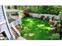 Expansive lush backyard featuring vibrant greenery, manicured landscaping and ample space at 420 Solomon St, Charlotte, NC 28216