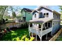 Beautiful backyard featuring a spacious deck and manicured lawn, perfect for outdoor enjoyment at 420 Solomon St, Charlotte, NC 28216