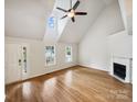 Bright living room featuring vaulted ceilings, a fireplace, and hardwood floors at 4222 Mt Gallant Rd, Rock Hill, SC 29732