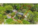 Aerial view of property with mature trees, well-maintained lawn and landscaping at 6921 Thermal Rd, Charlotte, NC 28211