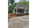 Inviting single-story home featuring a covered porch, perfect for relaxing outdoors at 833 Arlington Ave, Rock Hill, SC 29730