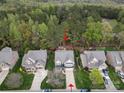 A beautiful home nestled among lush trees and manicured lawns in a serene neighborhood at 9069 Blue Ridge Dr, Indian Land, SC 29707