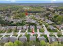 Picturesque aerial view of a neighborhood with a community pool surrounded by lush greenery and homes at 9069 Blue Ridge Dr, Indian Land, SC 29707