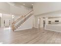 Spacious foyer featuring high ceilings, hardwood floors and staircase at 10325 Merlin Meadows Ct, Charlotte, NC 28277