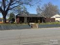 Charming brick home with a landscaped front yard and inviting entrance at 110 Buffalo Nw Ave, Concord, NC 28025