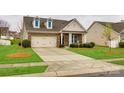 Charming brick home with dormer windows, manicured landscaping, and a spacious driveway at 1129 Black Walnut Rd, Clover, SC 29710