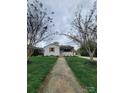 Inviting one-story home framed by trees, featuring a well-maintained lawn and classic architecture at 1421 Van Nuys St, Salisbury, NC 28144