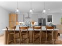 Beautiful kitchen island featuring a white countertop and stylish seating at 215 Keswick Ave, Charlotte, NC 28206