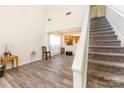 Light and bright living room with a staircase and modern flooring at 2409 Deberry Ct, Charlotte, NC 28213