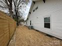 View of the backyard with the house and the AC unit at 312 W Henderson St, Salisbury, NC 28144