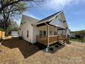 Inviting exterior with a charming porch and well-manicured lawn at 312 W Henderson St, Salisbury, NC 28144