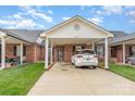 Charming single-story home with a covered carport, nestled in a serene neighborhood with lush green lawns at 3921 Sage Ct, Denver, NC 28037