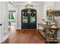 Welcoming foyer with hardwood floors, chandelier, and decorative console table near the front door at 4012 Flagstone Dr, Lancaster, SC 29720