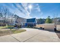 Charming lakefront home featuring a long driveway and covered porch at 428 Pinehaven Dr, New London, NC 28127