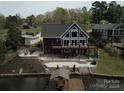 Stunning lake house with a large deck and outdoor patio space at 428 Pinehaven Dr, New London, NC 28127