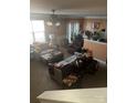 Spacious living room with neutral walls features plush furnishings, a ceiling fan, and great natural light at 4831 Belmar Place Rd, Charlotte, NC 28269