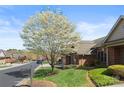 Street view of a charming home with a lovely flowering tree and well-maintained lawn at 489 26Th Ne Ave # C, Hickory, NC 28601