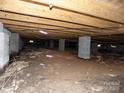 View of the crawl space showing support pillars and beams at 543 Queens Rd, Gastonia, NC 28052