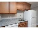 Kitchen featuring granite countertops, ample cabinetry, and modern appliances at 676 Forest Nw St, Concord, NC 28025