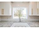 Close-up of the kitchen sink with a view to the backyard at 678 Wagner St, Troutman, NC 28166