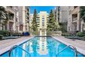 Inviting rectangular swimming pool surrounded by landscaped gardens in a well-maintained community at 718 W Trade St # 808, Charlotte, NC 28202