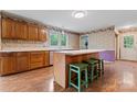 Charming kitchen featuring wooden cabinets and a central island with seating at 109 Windmill Rd, Salisbury, NC 28147