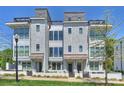 Beautiful townhome exterior showcasing modern architecture, multi-story windows, and rooftop decks at 1105 Reece Rd, Charlotte, NC 28209