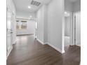 Well lit hallway boasts beautiful, modern, neutral tones and hardwood flooring throughout at 1125 Hallman Branch Ln, Lincolnton, NC 28092