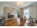 Inviting living room with hardwood floors, decorative lighting, and a cozy seating arrangement at 117 Middleton Pl, Mooresville, NC 28117