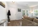Inviting entryway featuring wood floors, coat rack, and sunlit windows at 1248 Century Dr, Clover, SC 29710
