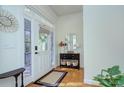 Bright foyer features hardwood floors, natural light, and stylish decorative accents at 15236 Waterfront Dr, Huntersville, NC 28078