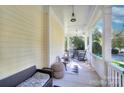 Cozy front porch features seating and a ceiling fan for relaxing outdoor enjoyment at 15236 Waterfront Dr, Huntersville, NC 28078
