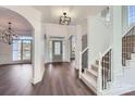 Spacious foyer with gleaming hardwood floors, a grand staircase, and soaring ceilings at 18038 Greyfield Gln, Fort Mill, SC 29707