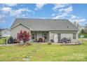 Charming backyard with a patio, outdoor seating, and a well-maintained lawn, perfect for outdoor relaxation at 2408 Joes Lake Rd, Shelby, NC 28152