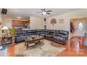 Inviting living room showcasing hardwood floors, ceiling fan, and a comfortable seating arrangement with a floral rug at 2408 Joes Lake Rd, Shelby, NC 28152