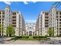 Elegant condo buildings with balconies and a beautifully landscaped entrance, exuding sophistication and charm at 2823 Providence Rd # 143, Charlotte, NC 28211