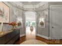 Inviting foyer with arched doorway, hardwood floors, and stylish decor, creating a warm and welcoming ambiance at 2823 Providence Rd # 143, Charlotte, NC 28211