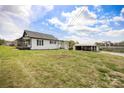 Spacious yard featuring a charming home with covered porch and an open shed at 382 Cole Campbell Rd, Taylorsville, NC 28681