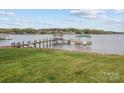 Picturesque backyard view featuring a private dock and boat slip on the water at 477 Big Indian Loop, Mooresville, NC 28117