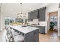 Spacious kitchen features a large kitchen island, stainless appliances, and ample natural light at 510 Poindexter Dr, Charlotte, NC 28209