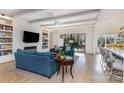 Bright living room featuring a fireplace, built-in shelving, and access to the patio at 510 Poindexter Dr, Charlotte, NC 28209