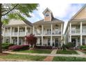 Charming two-story home with double porches, manicured landscaping, and inviting curb appeal at 5121 Alysheba Dr, Indian Trail, NC 28079
