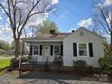 Charming single-story home with a covered front porch and mature trees in a quaint neighborhood at 526 Arlington Ave, Albemarle, NC 28001