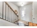Entryway features a white front door and a view of the staircase at 7144 Hodges Meadow Ln, Charlotte, NC 28213