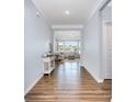 Bright foyer with hardwood floors leading to a living room filled with natural light at 108 Toxaway St, Mooresville, NC 28115