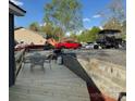 A wooden deck with a table and chairs, great for outdoor enjoyment at 113 Hideaway Trl, Mount Gilead, NC 27306