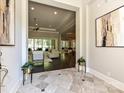 Spacious foyer with tiled floors that flows into an open-concept living area with natural light at 11447 Egrets Point Dr, Charlotte, NC 28278